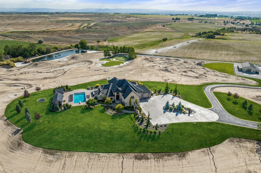 42+ acres with custom home, 2 motocross track, BMX track, large pond with wakeboard pulley, tiki hut, jet ski, go karts, go kart track, well equipped CrossFit gym, indoor basketball court, sand volleyball, pool and pool house, hot tub, golf tee boxes, putting green and so much more!
